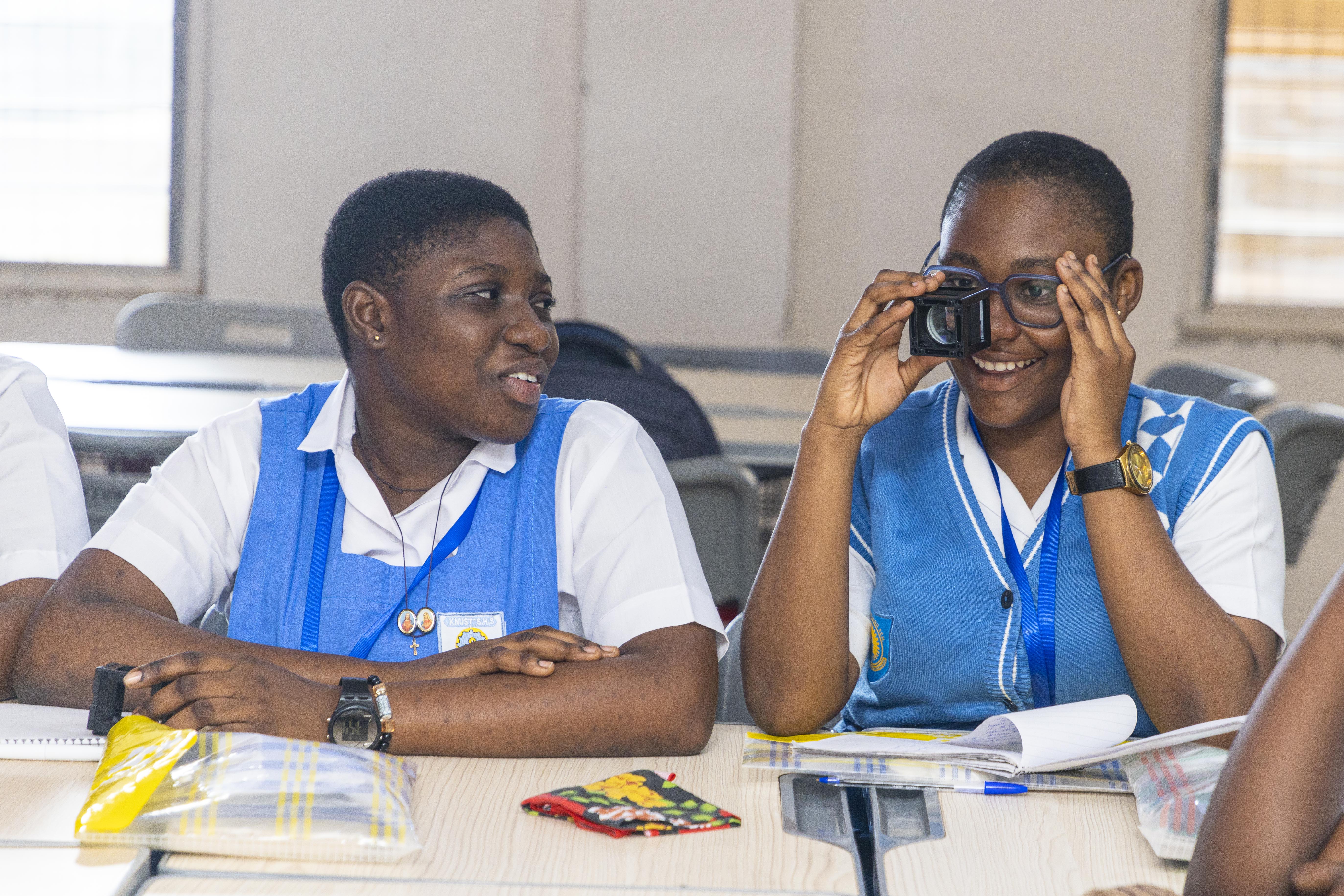 Students with a lens.